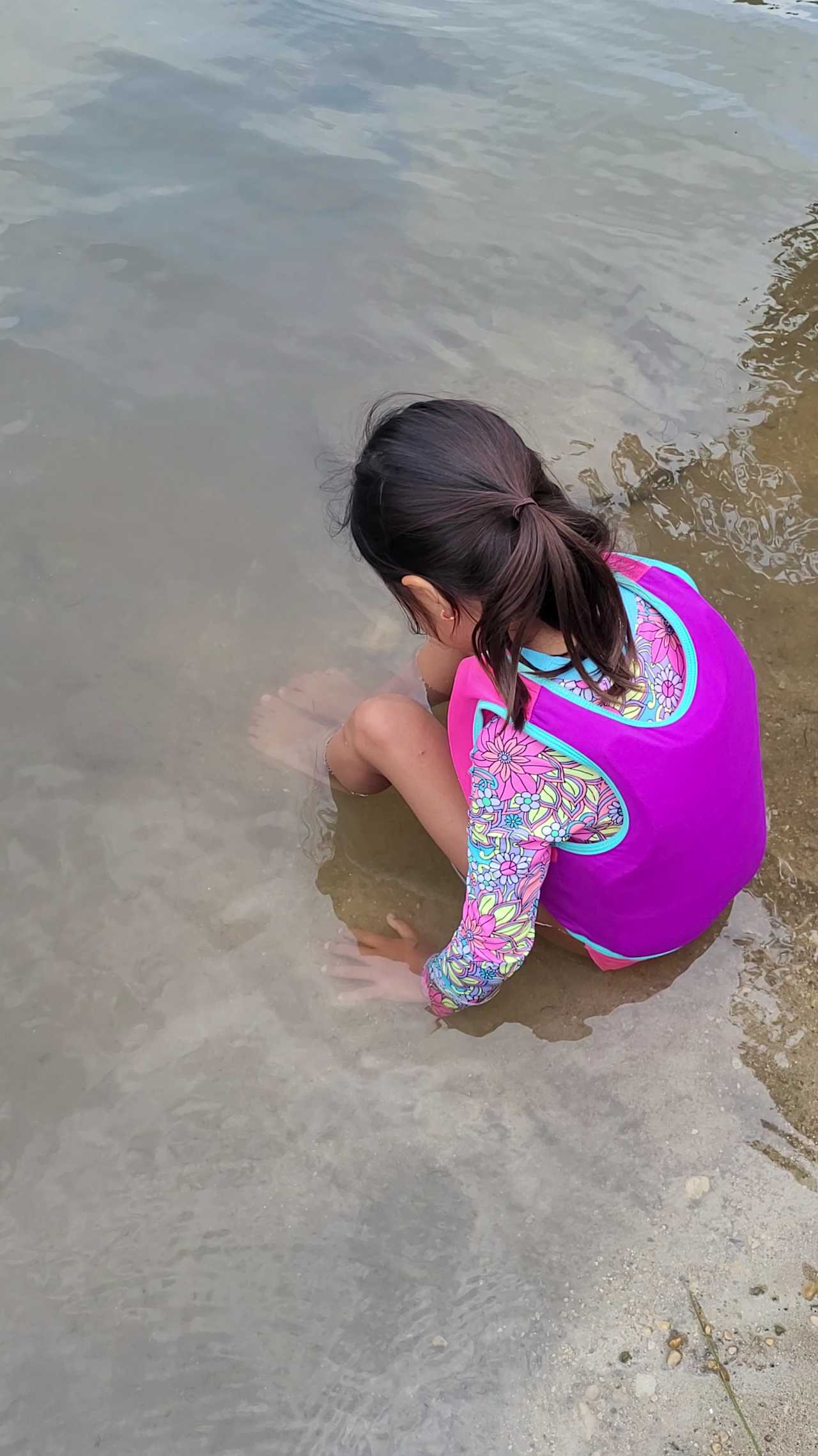 Sit on the edge of the water and sit still. You will get a relaxing fish spa. Yes! The tiny fish will nibble on your dead skin of you sit still.