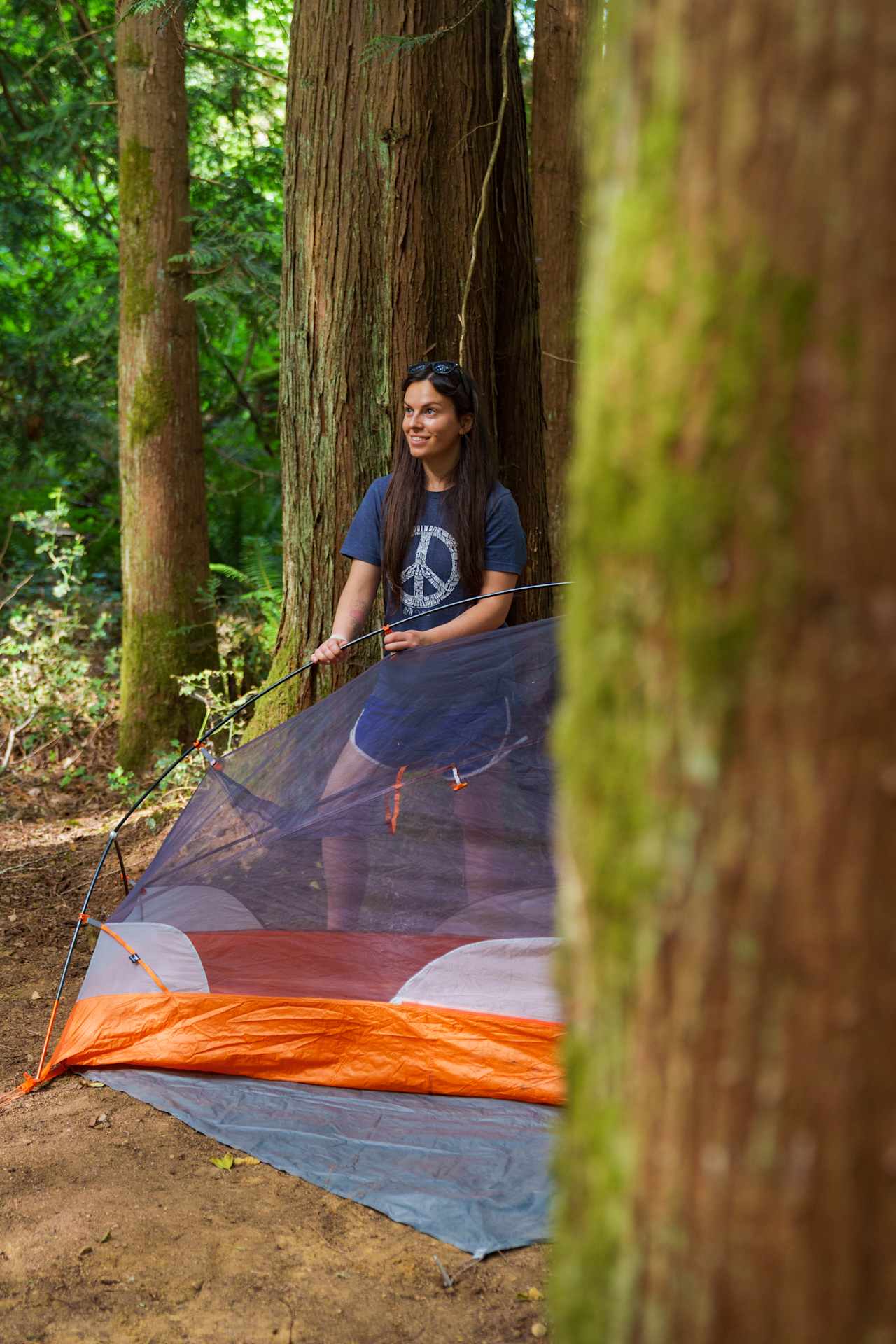 Setting up our tent in the trees! So fun!