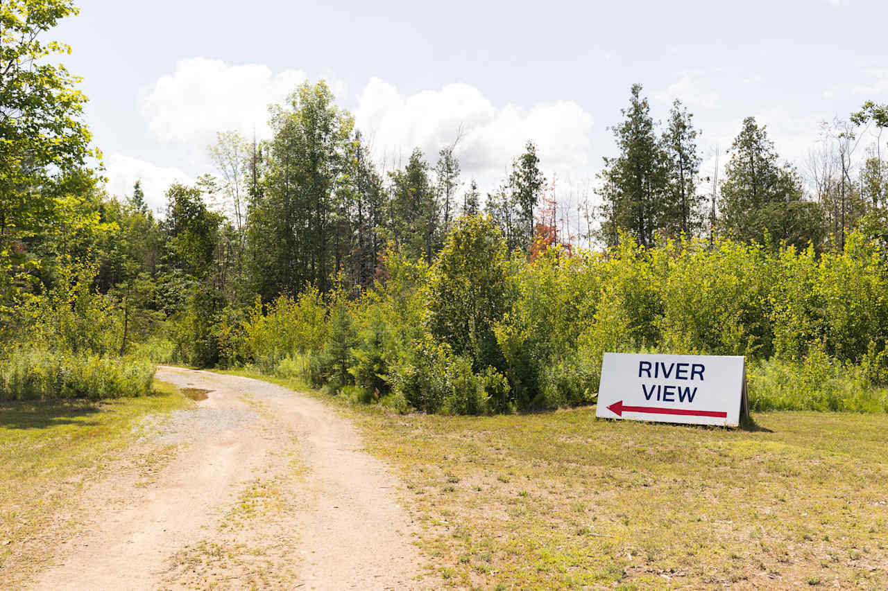 You’ll see this sign after pulling into the business site and drive straight pst the building along the dirt road