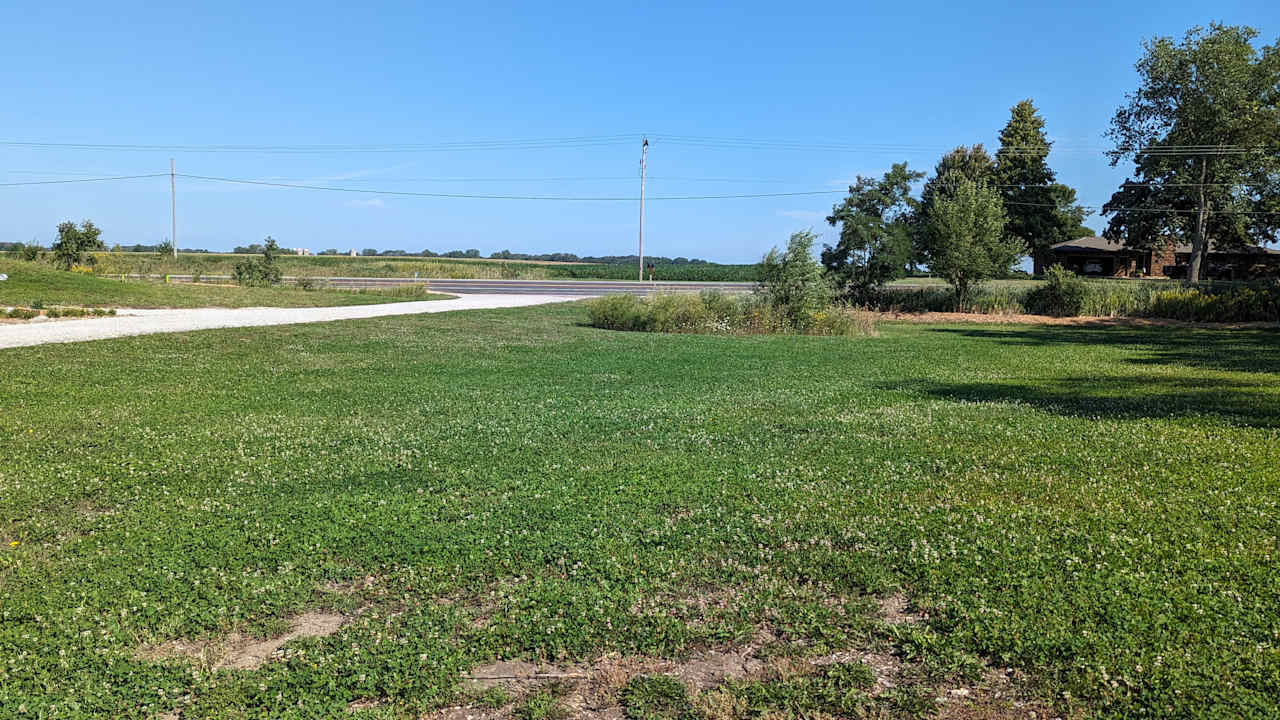 View of the driveway and road from the field.