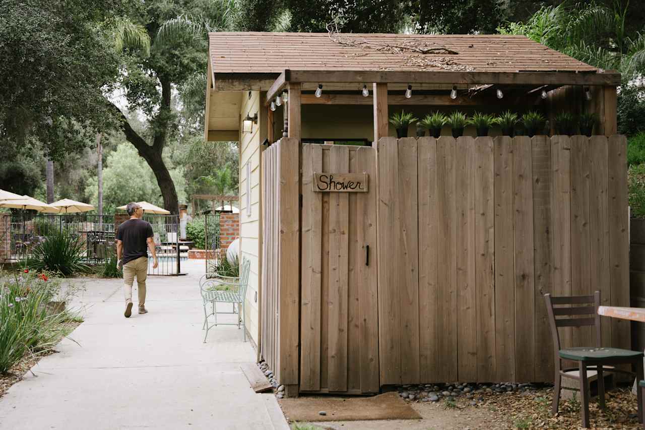 outdoor shower and indoor restroom