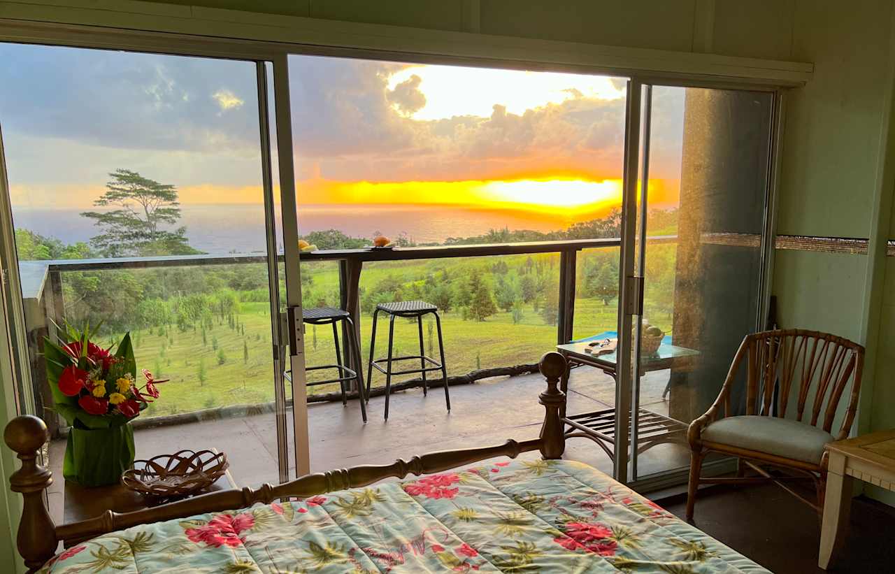 Sunrise view over the ocean from bed!