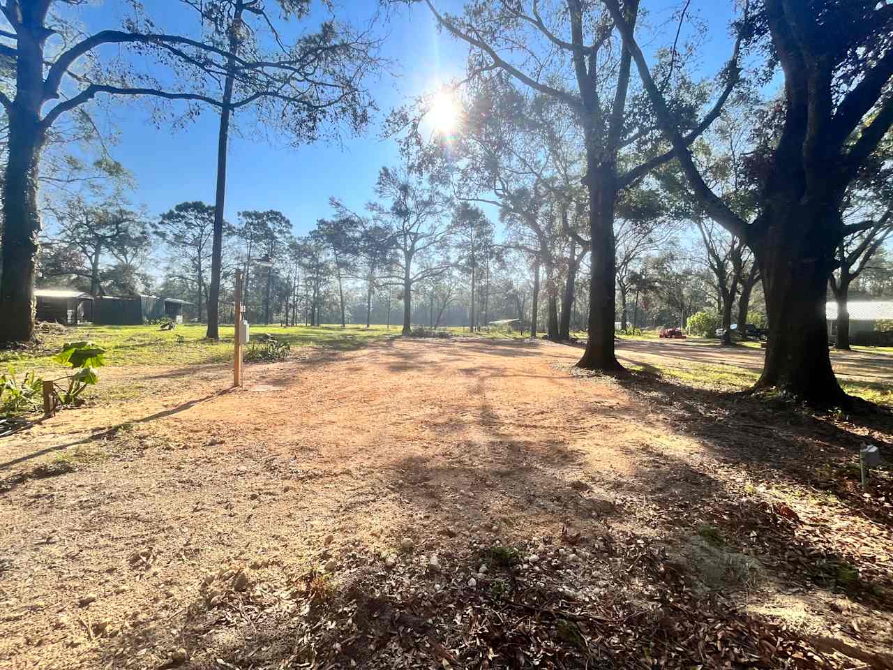 Forward view of RV pad, the front of your vehicle will face the pasture area. Water, power and septic located on the left of pad. 