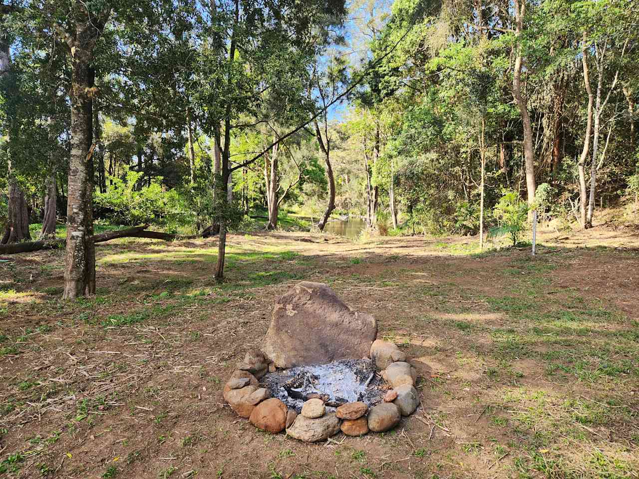 Enjoy the campfire while watching the creek