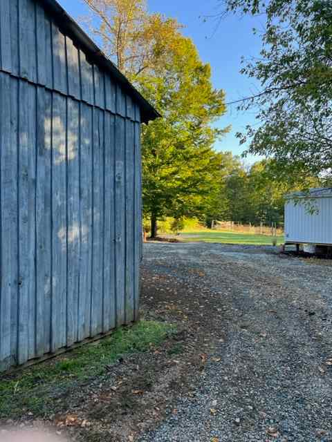 You'll pull right past the old pole barn to hook into shore power which is out the back of the white building on the bottom right of this photo. 