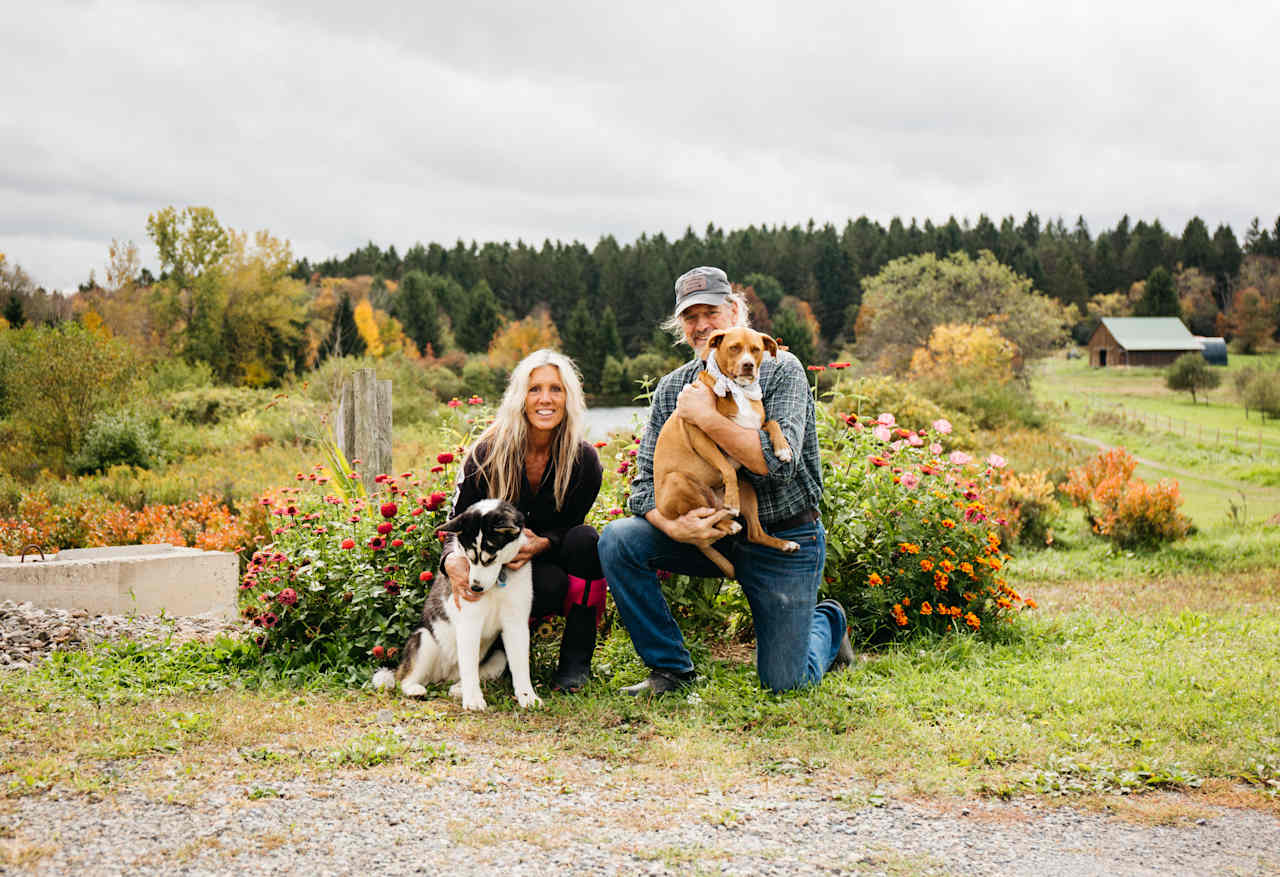 Hosts Amy and Brian with their two pups.