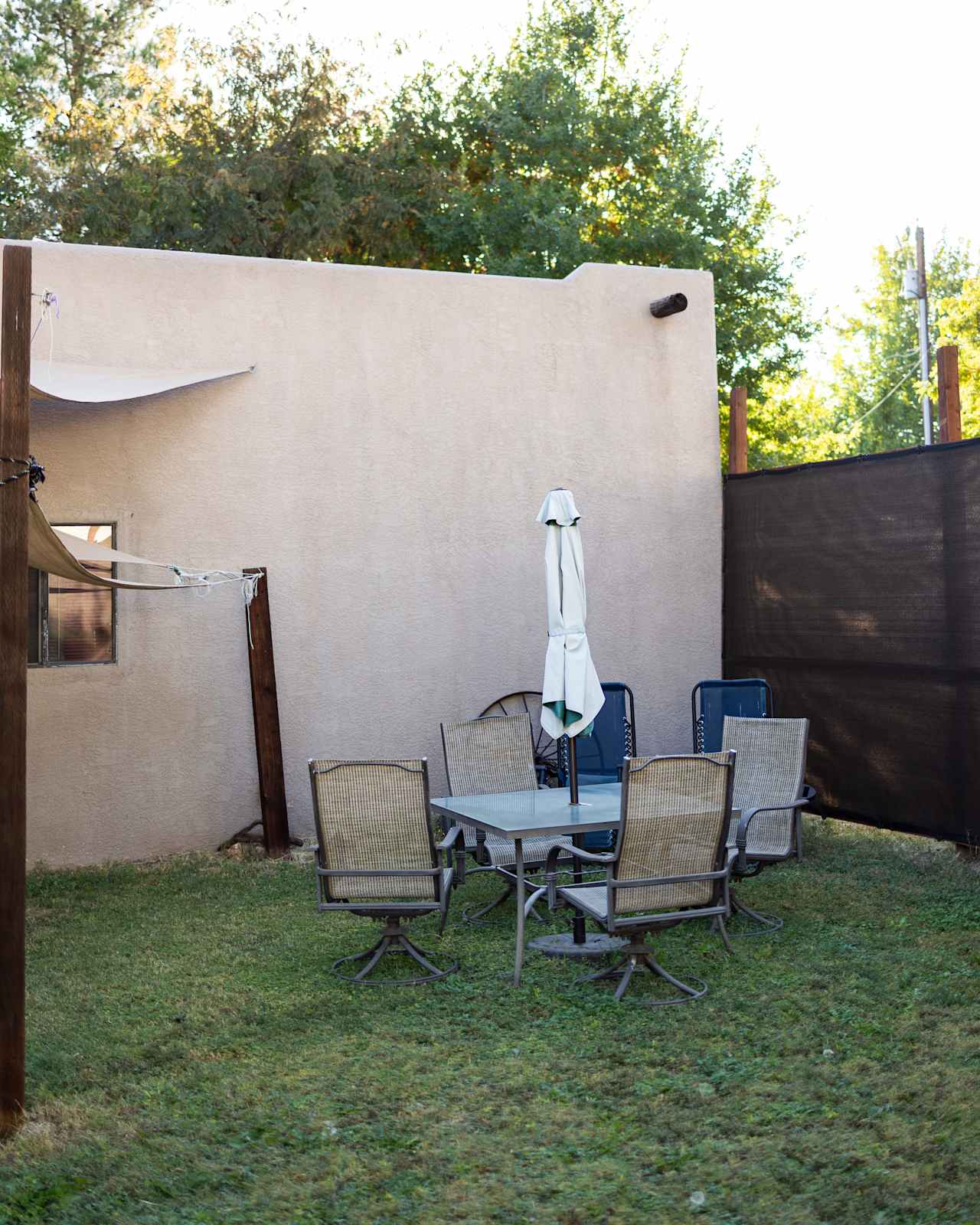 Outdoor seating with sunshades and umbrella for mid day sun 