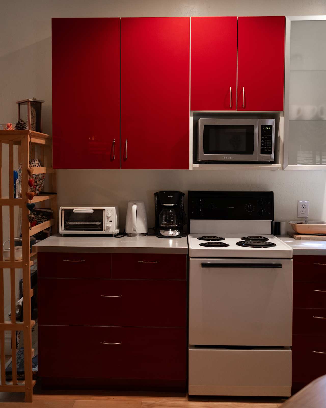 Full kitchen with microwave, oven, stove top, and refrigerator 