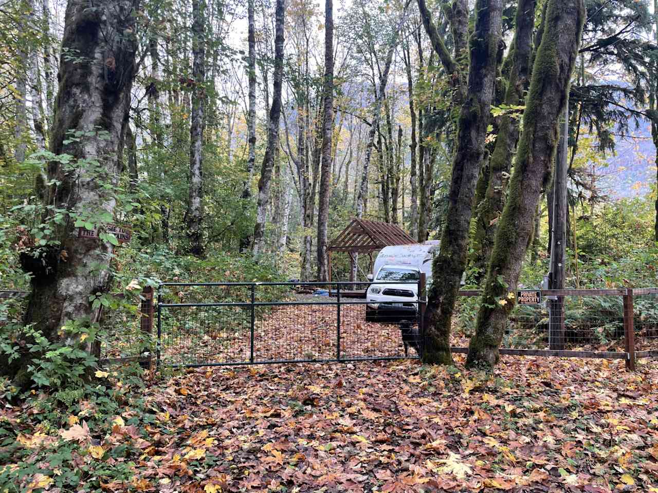 This photo is from standing in the road looking in.  Park behind gate in driveway. 