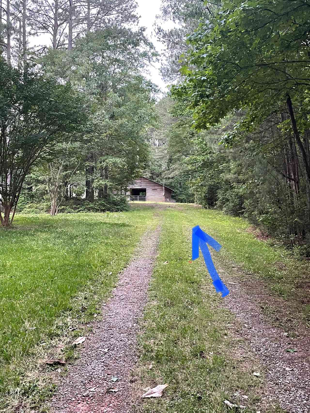 Partially paved driveway to the barn.