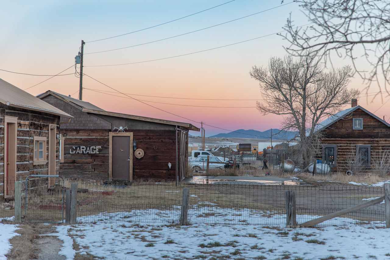 The sunset behind neighboring cabins