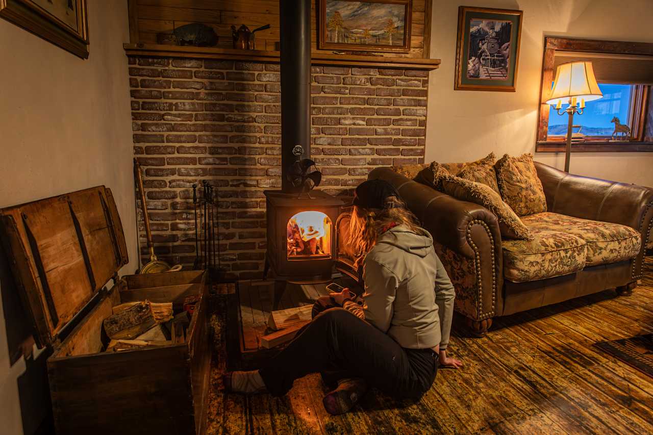 Adding wood to the stove