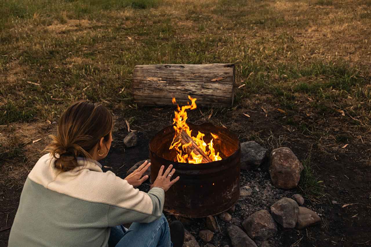 Warming up by the fire.