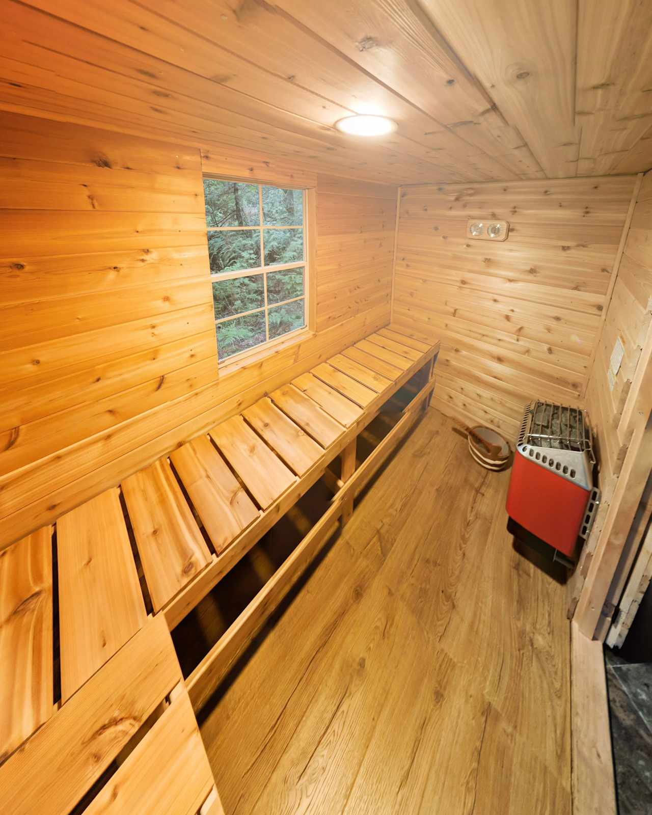 Beautiful cedar sauna with electric heater and lava rocks seat 4 comfortably. Bring your towel and have a good sweat! 