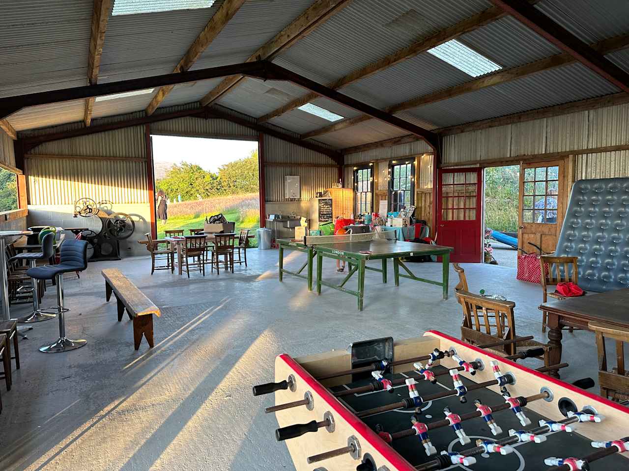 Our lovely camper's barn with fridge freezer, vintage ping pong table and lots of room to hang out and cook on your own stove if the weather is bad.