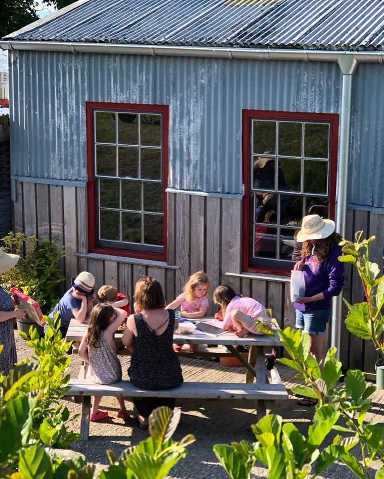 Our campers making some art at the picnic tables.