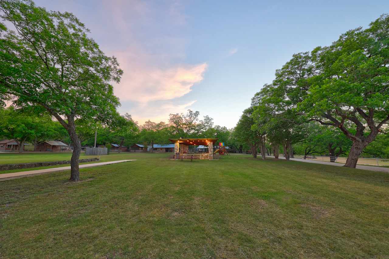 Central recreational area has ping pong, playground, washers pit