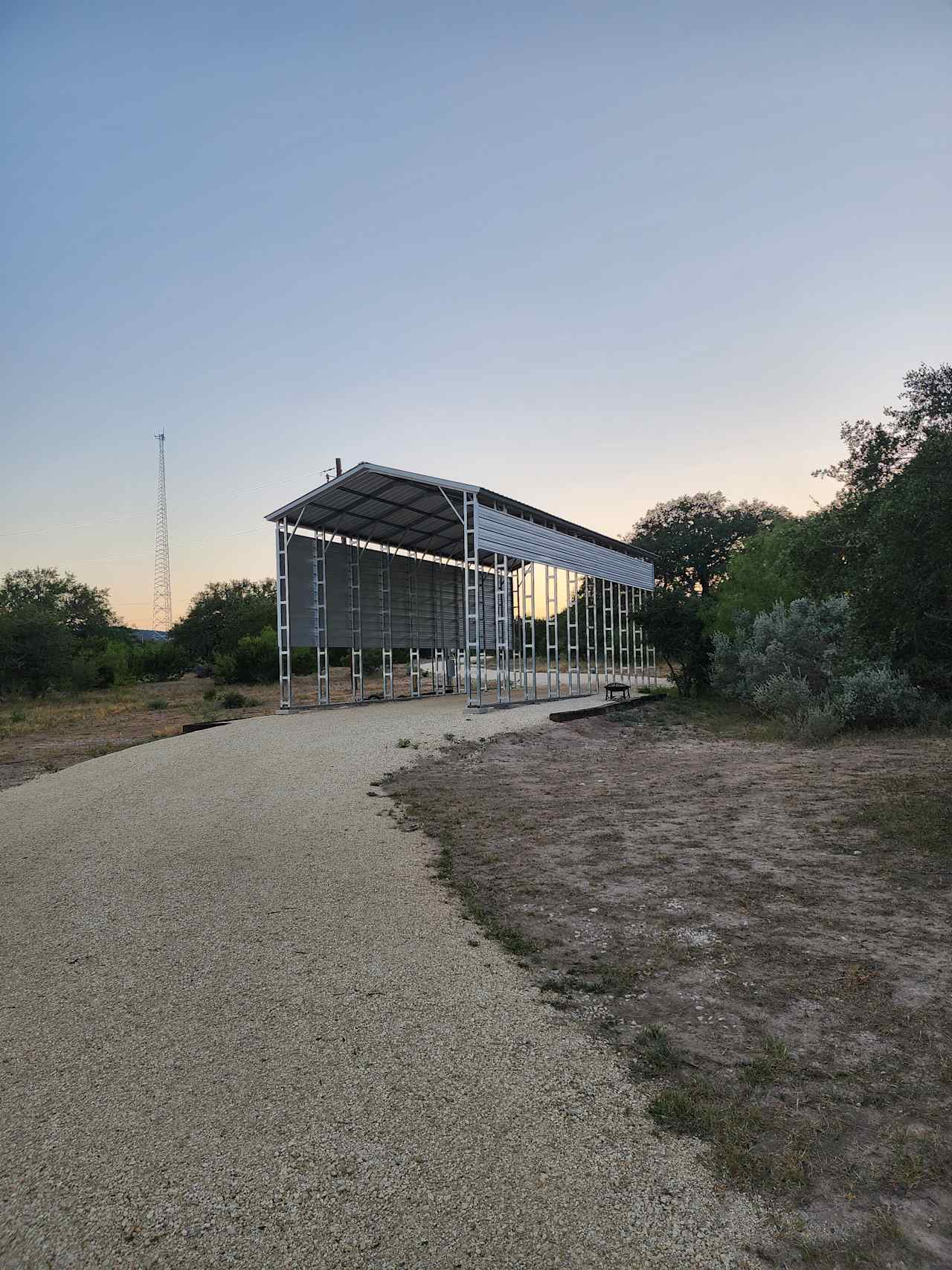 Beautiful Covered Parking Site, this is where you would pull in with the River Cottage at your back and the Pickleball court off to the right.