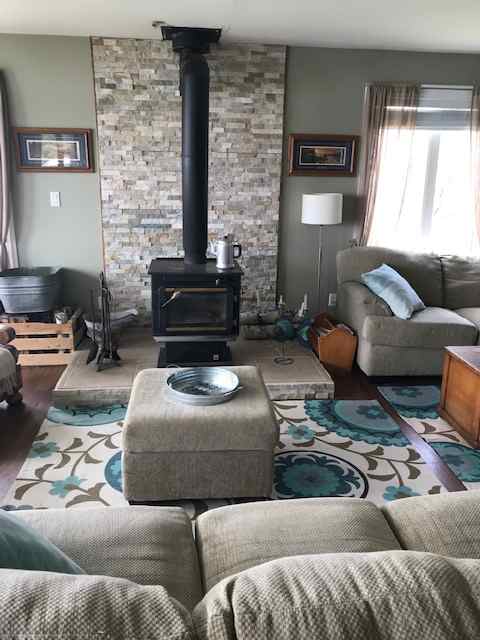 Comfy furniture and a warm woodstove - what more could you want?