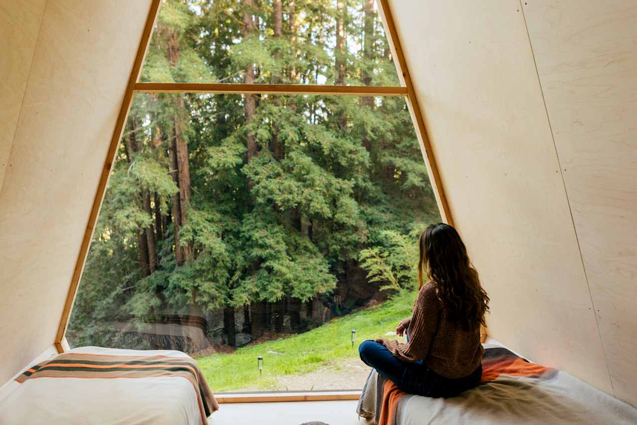 enjoying the view from inside the cozy a-frame