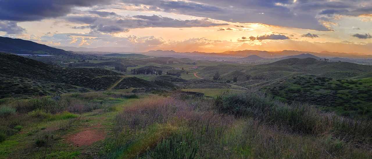 Unparalleled sunset views of the west valley of the conservation lands, privacy, private access, and a flat, level tent area. 