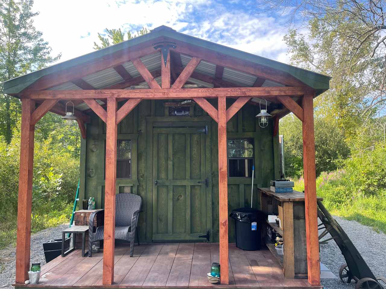 Front of private camp. Has porch and chairs to chill and bar to make dinner or drinks. Cabin has four windows for nice cross breeze. Cabin on 4 acres.