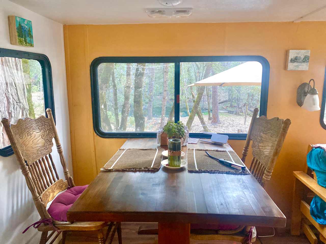 Indoor dining area with views of the forest and Clipper Creek.