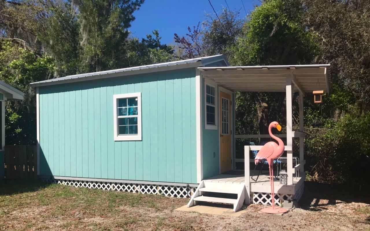 Very cute, cozy cottage -- rustic lakefront accommodations. Tiny house dimensions: 8-ft wide x 16-ft long "bunkhouse", sleeping loft with twin bed is nearly 4-ft deep and 8-ft wide accessible by step-ladder and a cot-width chaise lounge below; the porch decking is 8-ft wide by 6-ft deep with a generous sloping roof. 