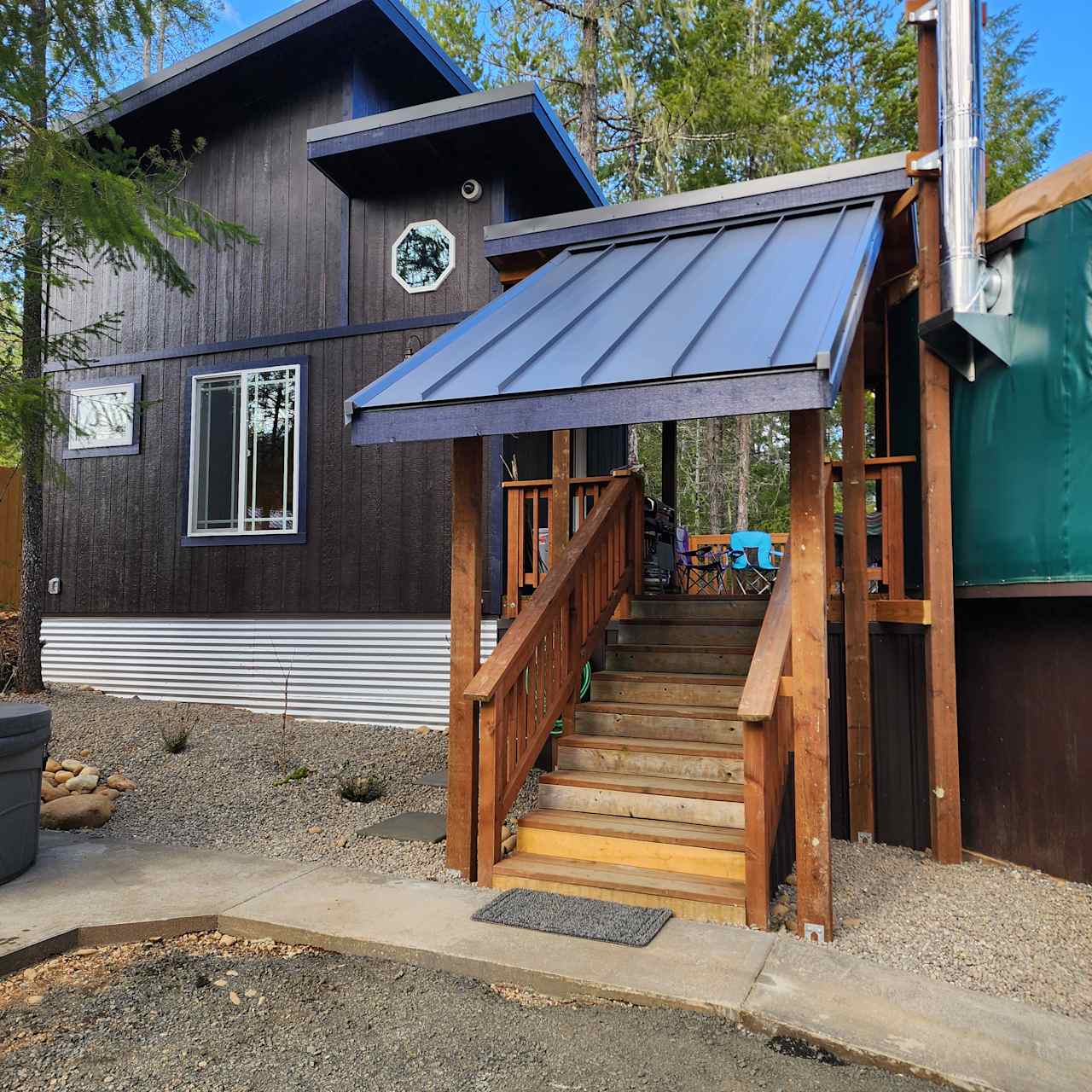 Entrance to yurt and cabin. Covered areas that protect from rain and snow!