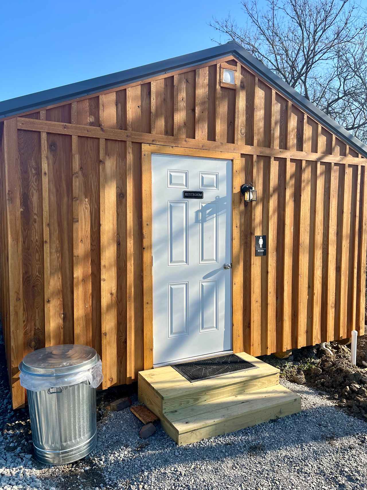 Entrance to the women's side of the restroom/shower house. These stairs are very sturdy and anchored to the building. Our bathrooms are cleaned daily.