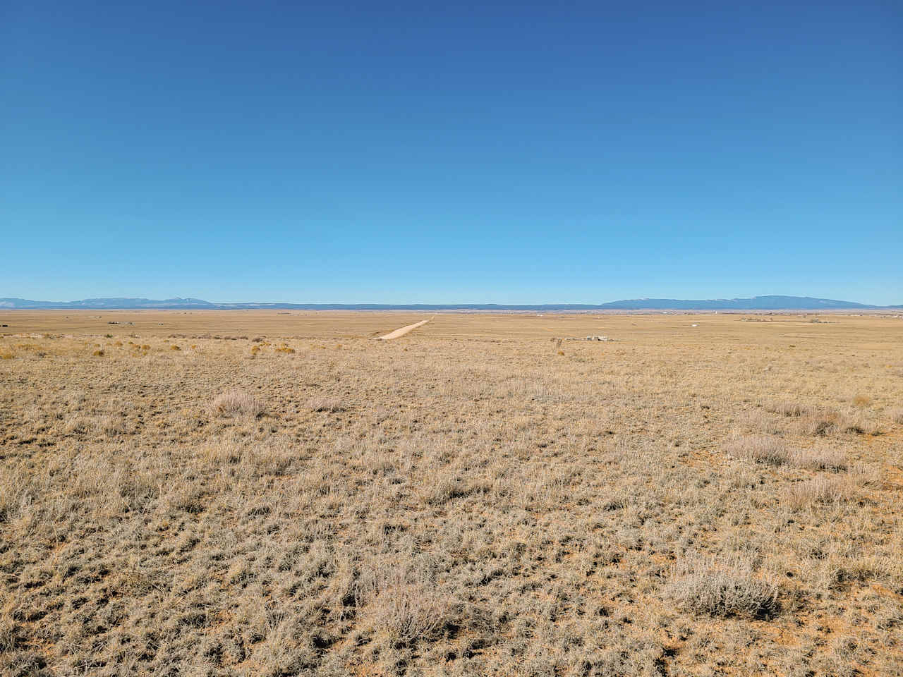 Well-maintained and wide county road in,  located just off I-40 and historic Route 66.