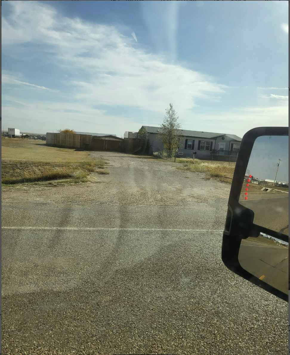 As you pull up to the property, this is the driveway that leads to the house where you can check-in and get situated.