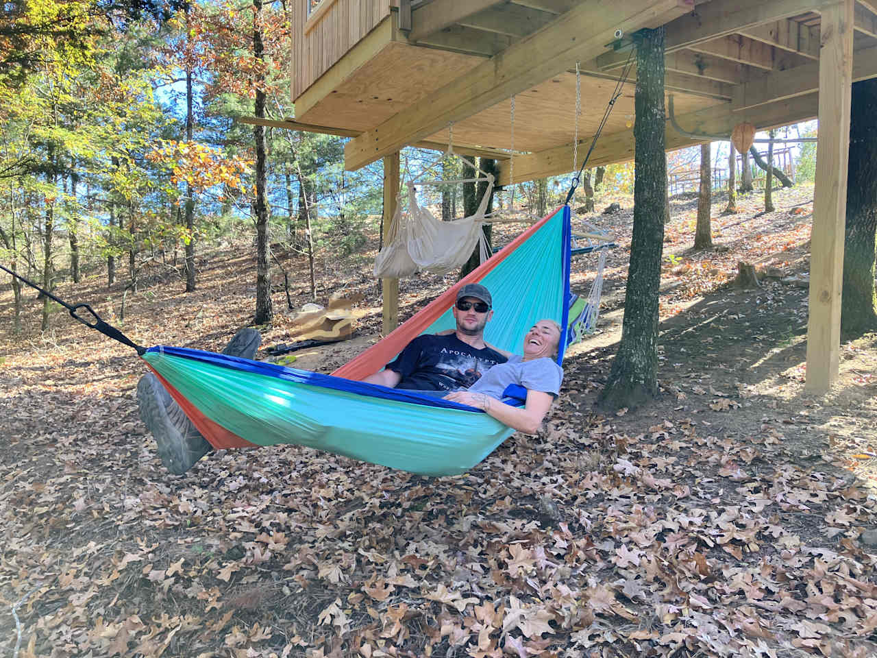 This hammock comes with a Tree House Stay.  It can hold 2 people up to 500 lbs.  Located under the tree house.  