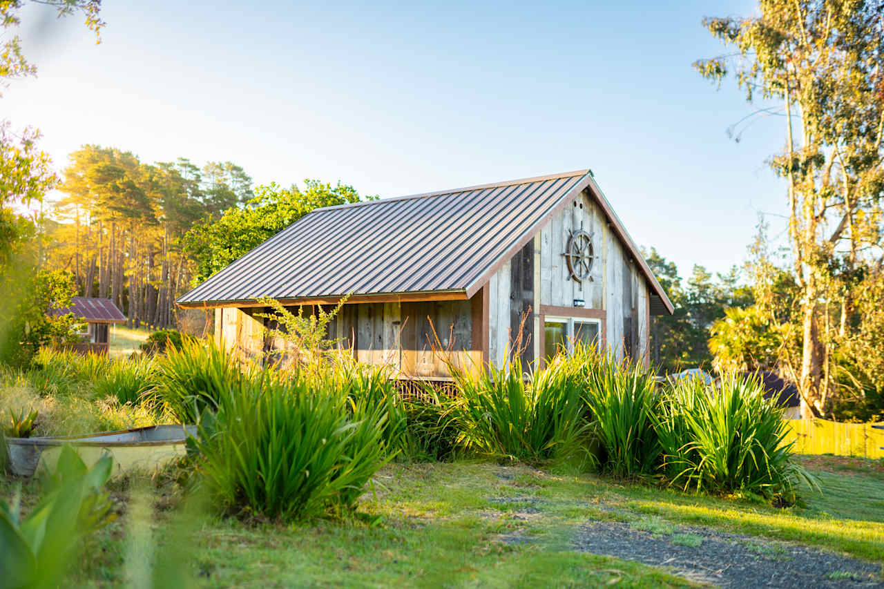 Greenery surrounds the cottage