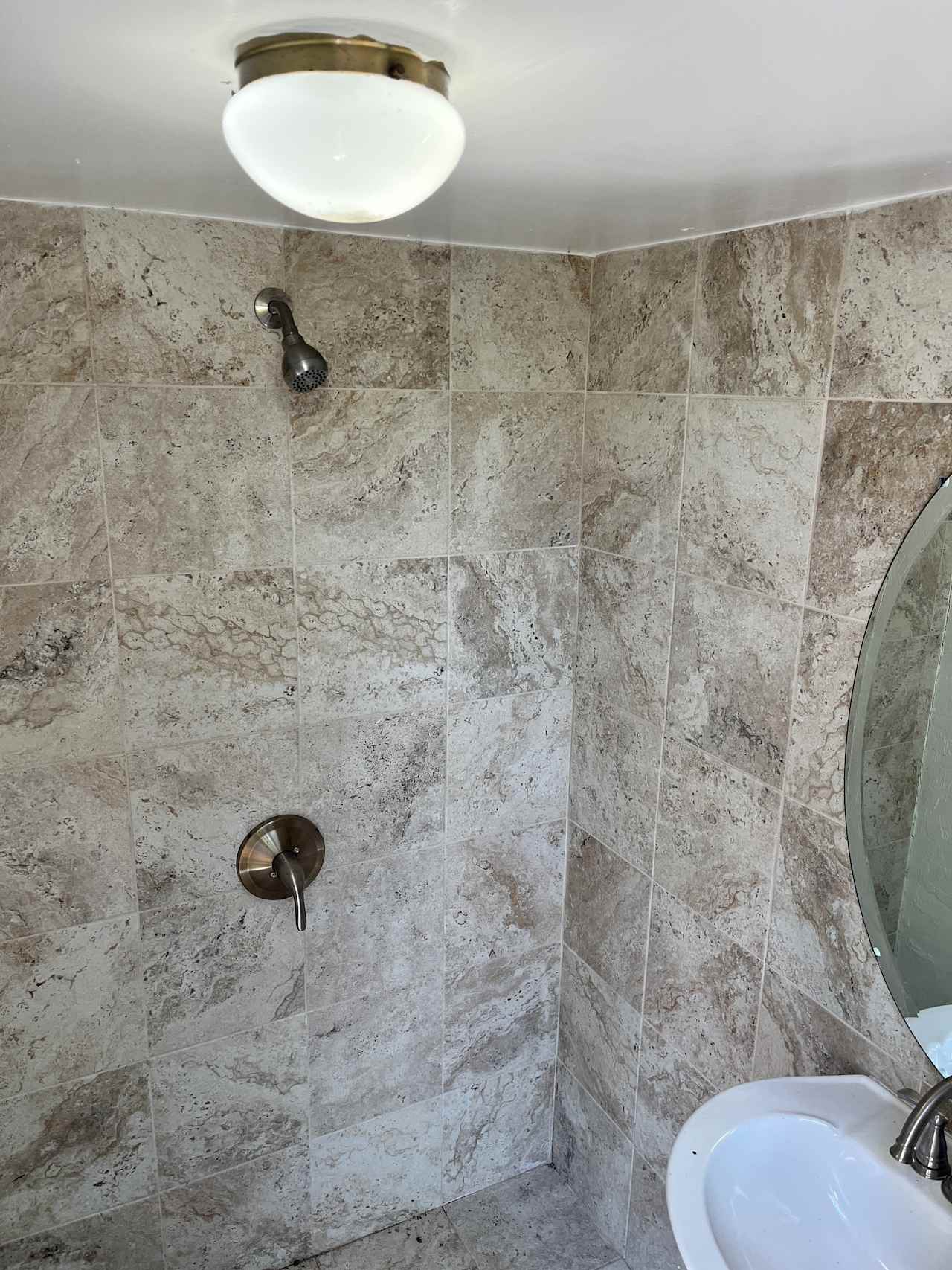 Private Outside bathroom with shower #hotwater located off the back of the house