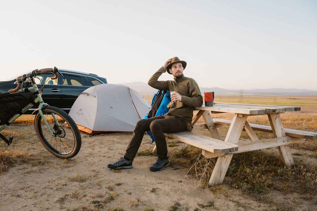 Holding my hat in high winds. Check the weather report before your trip!