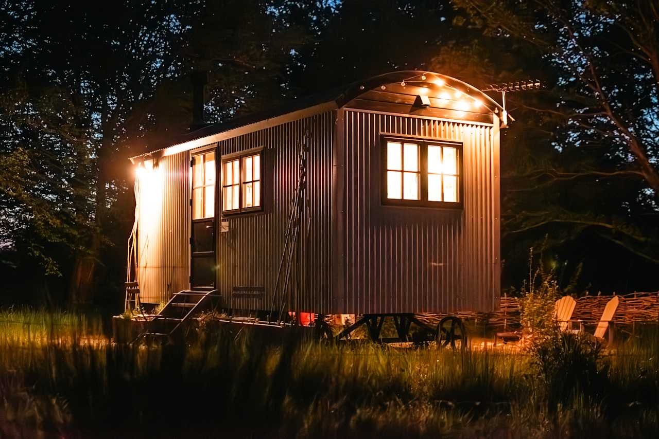 The hut fantastically lit at night.