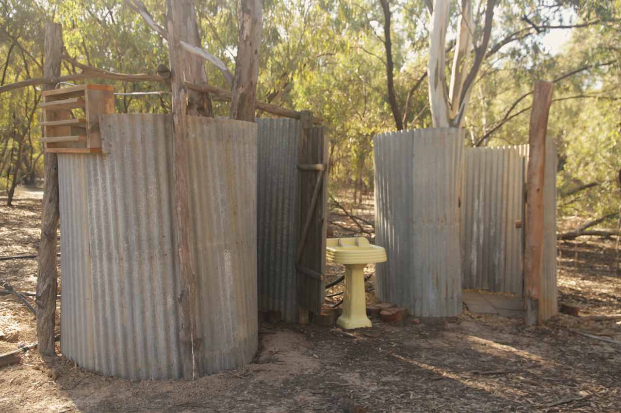 Cute rustic bathroom setup for Big Baja and No.3 camping areas with flushing toilet