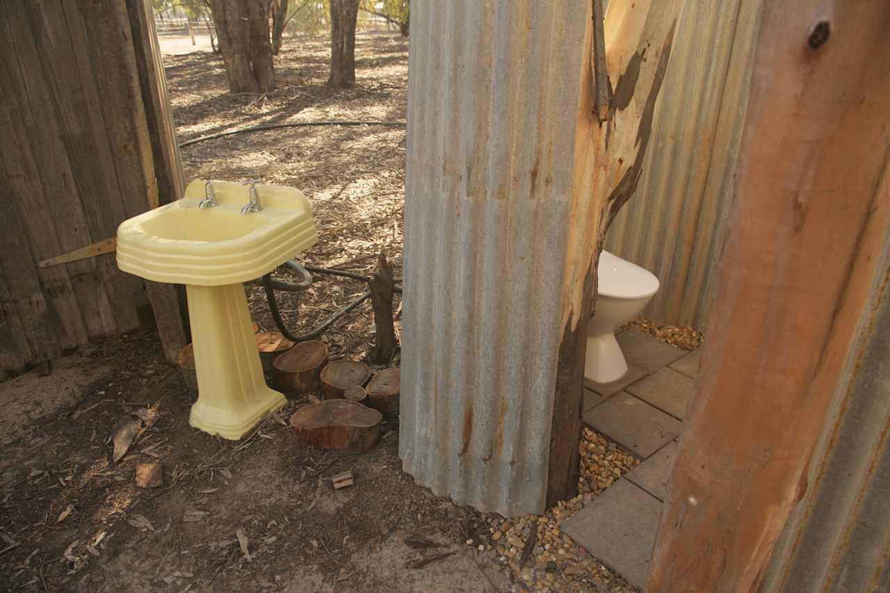 Beautiful quirky pedestal handbasin and flushing toilet cubicle shared by Big Bama and No.3 camping areas 