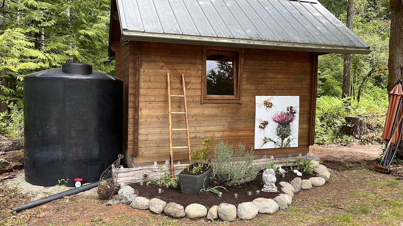 Putting the final touches to the cabin garden.