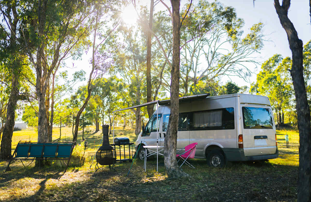 Another van setup among the trees