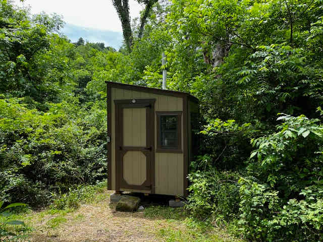 Clean outhouse available with composting toilet to use at this location.