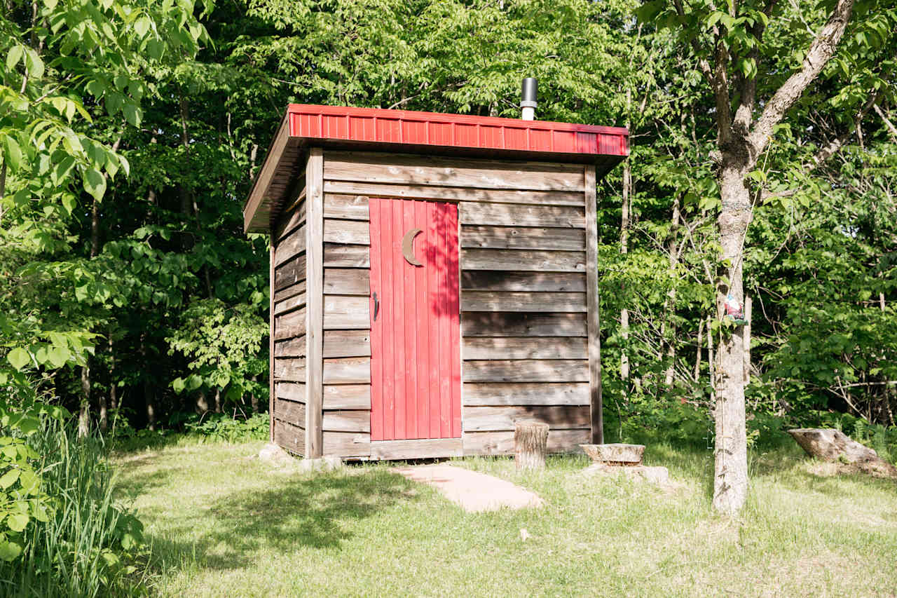 Fully stocked outhouse a few steps from the cabin