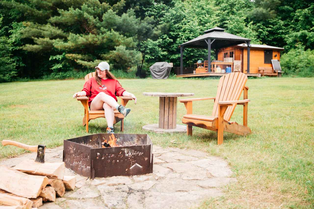 The large fire-pit area has plenty of chairs and tables to cook, eat and relax at