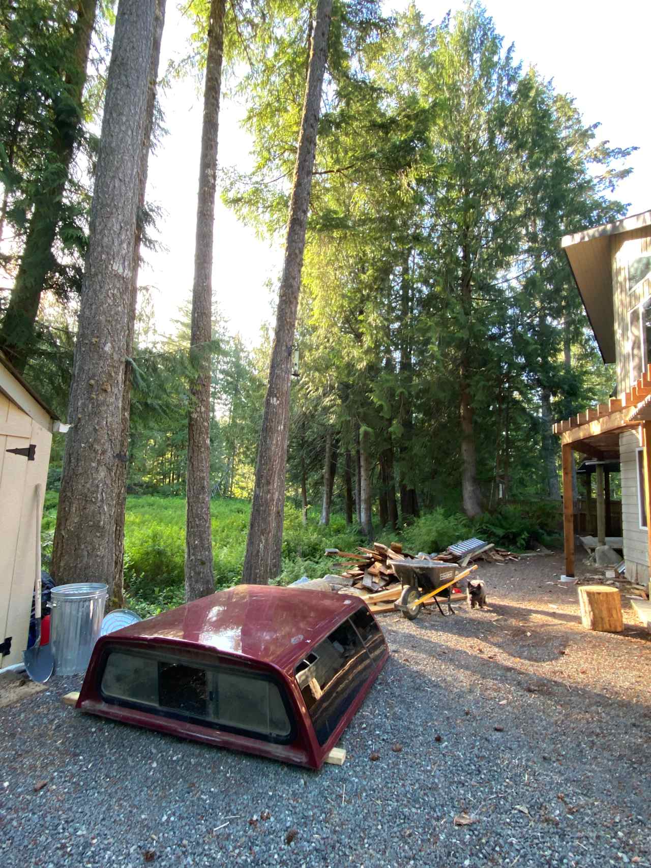 Located between the front of our home and the wetland.  RV/camper will be where wheelbarrow, canopy and wood is (deck construction almost finished, will take new photo asap) 