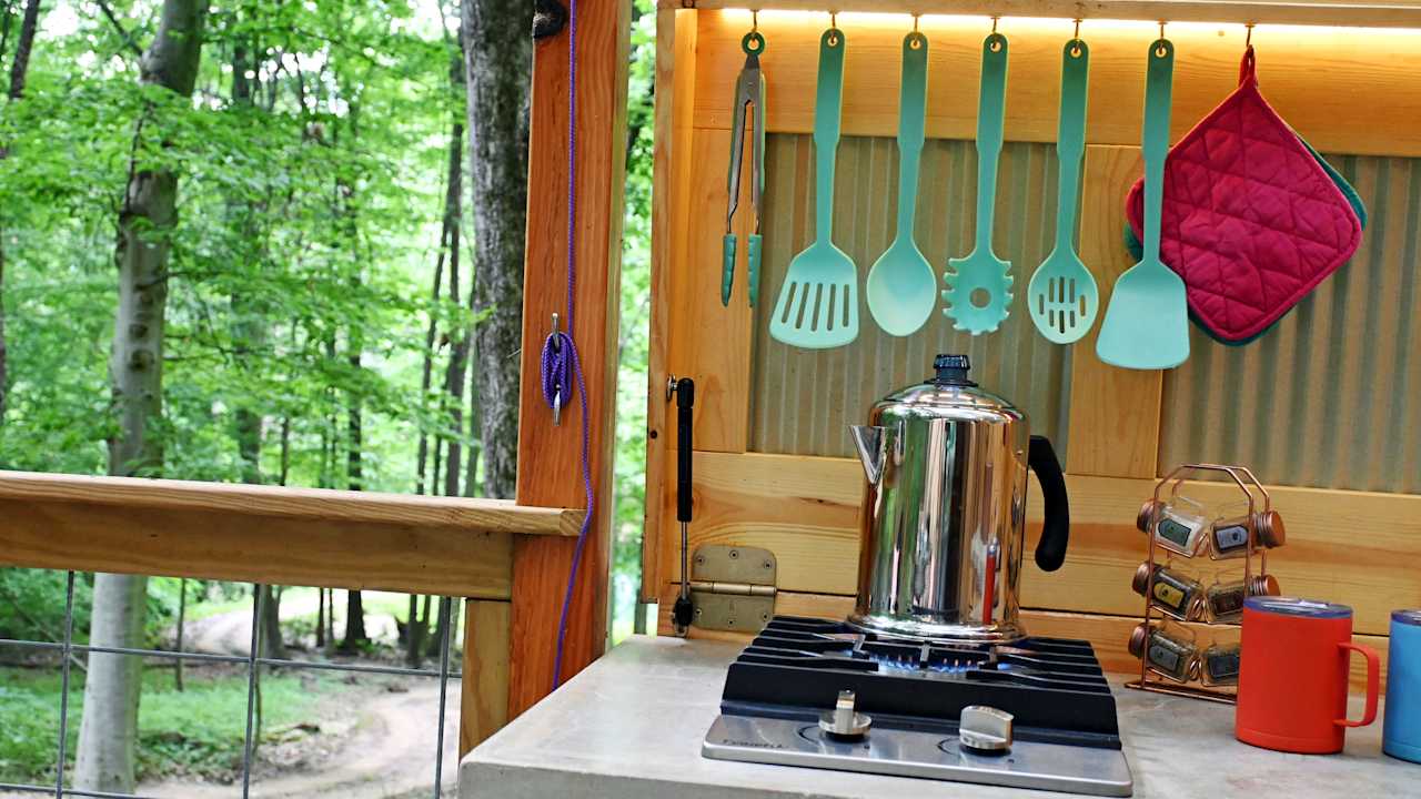 Wake up with the forest and savor a warm beverage under an early morning canopy of rustling green leaves.