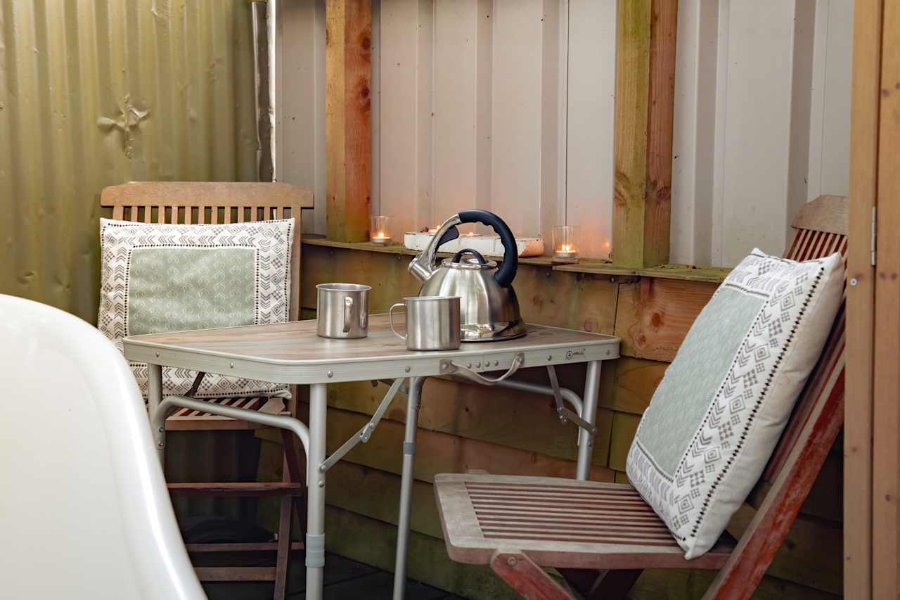 A small table is stored in the shepherds hut that can be brought out and used outside.