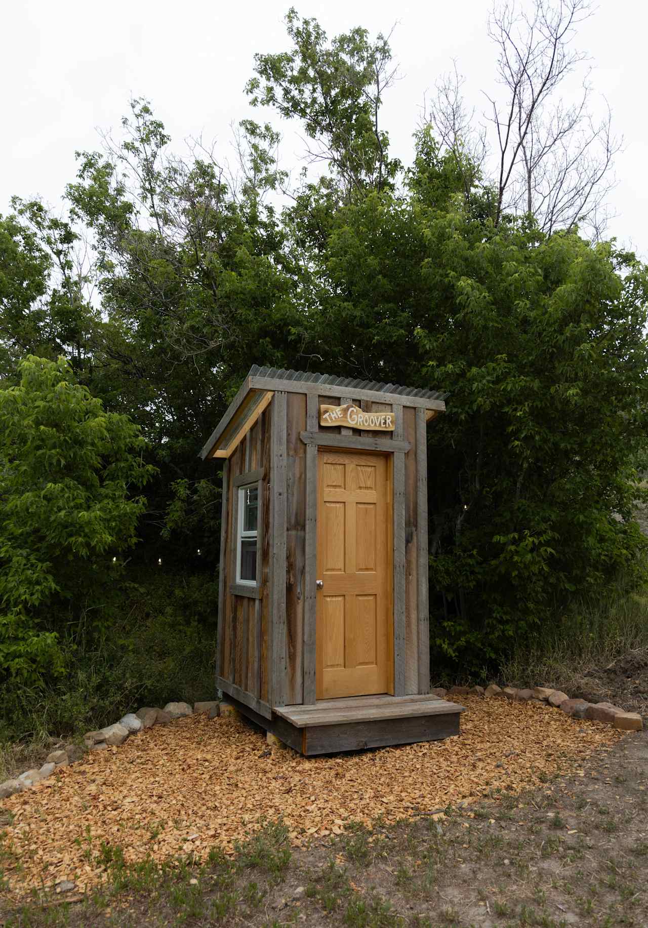 The Groover: a primitive (and very comfortable) composting toilet system following the "Humanure" method. That's right, we compost your poop!