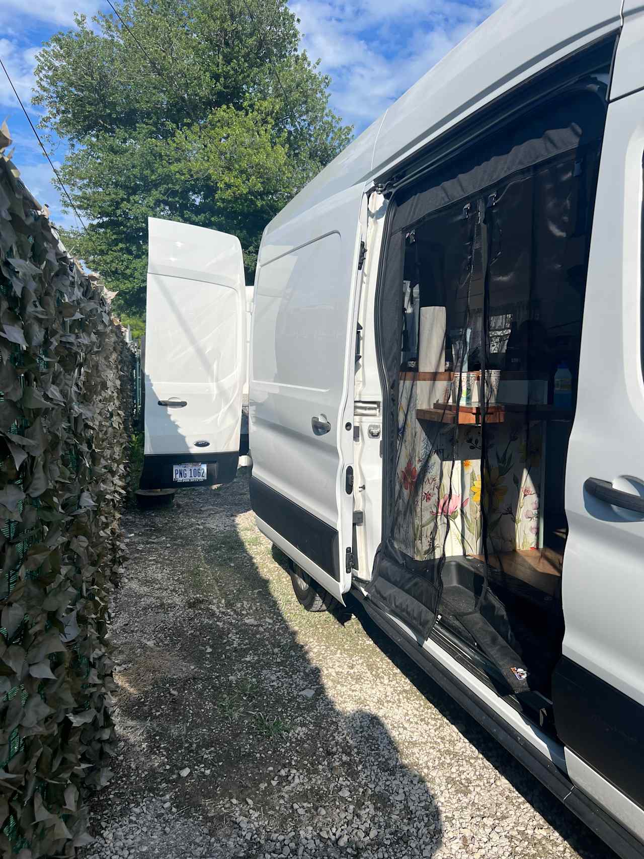 Van parked along the fence.