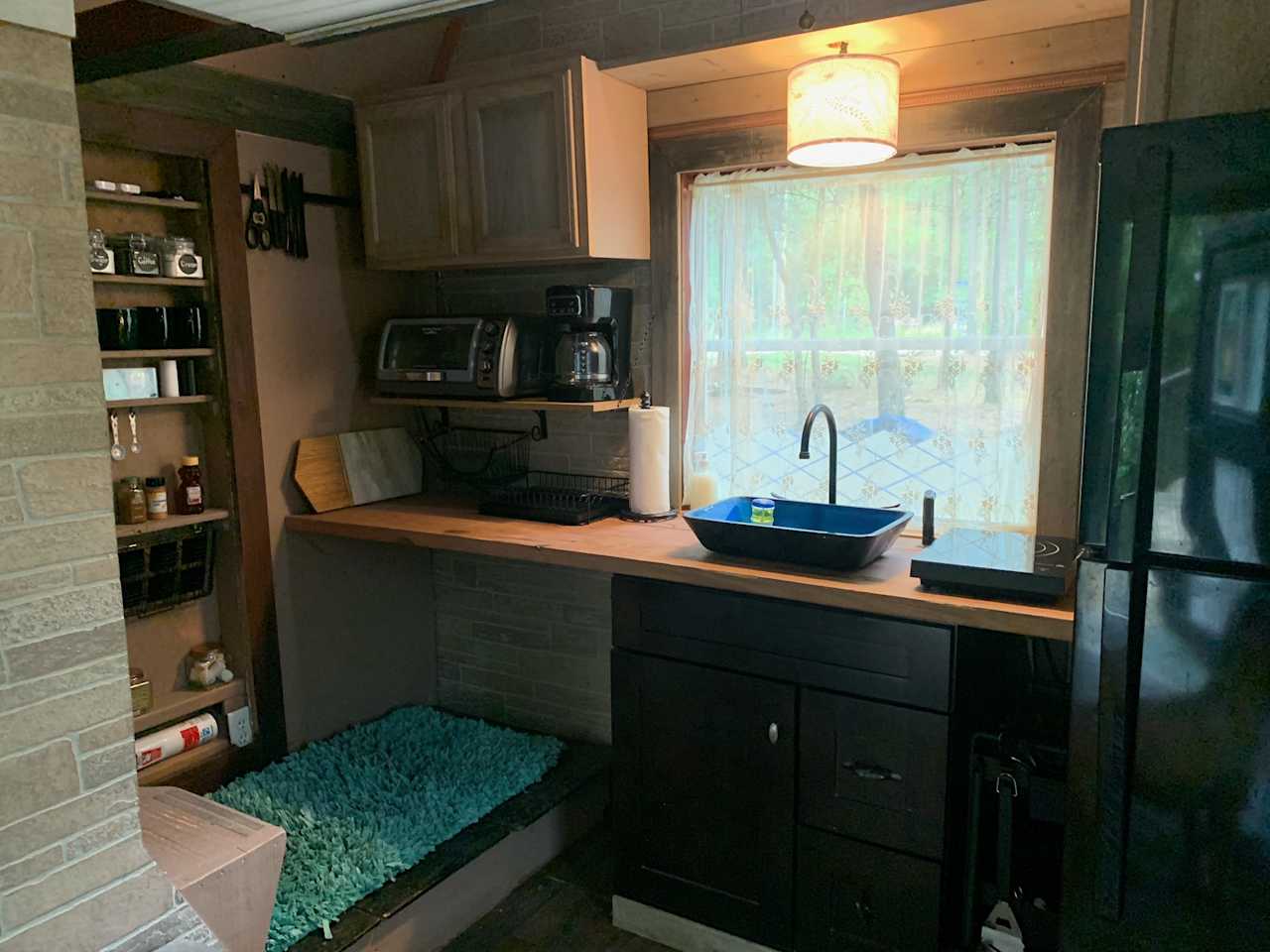 Tiny cabin kitchen: Toaster oven, coffee pot, and hot plate included. 